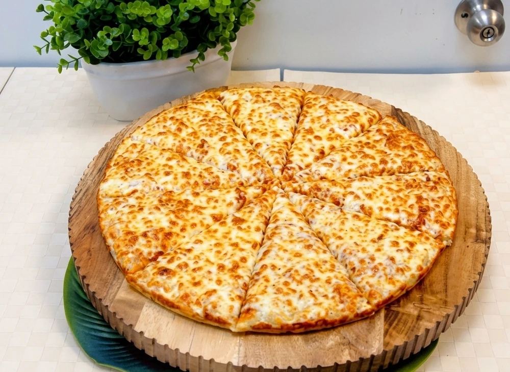 Fresh pepperoni and cheese pizza at New Pizza Factory in southeast Edmonton