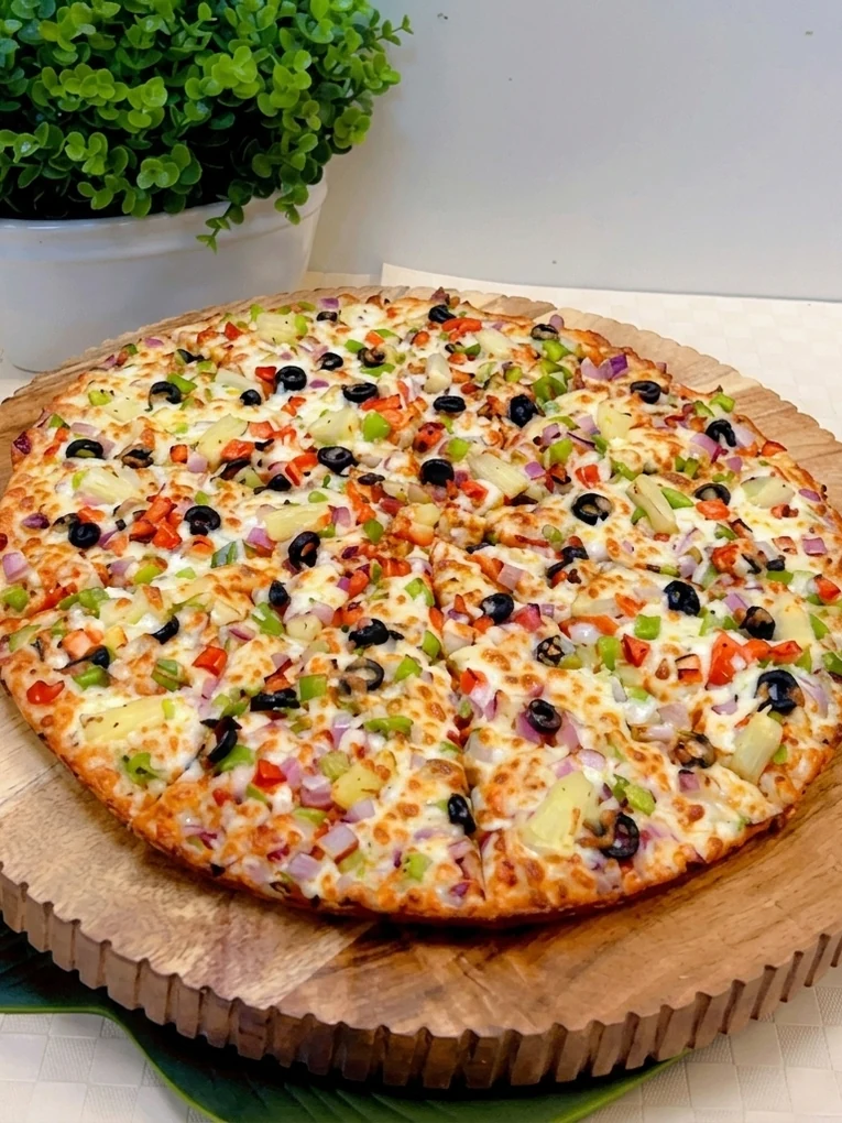 Loaded specialty pizza with generous toppings at New Pizza Factory in southeast Edmonton