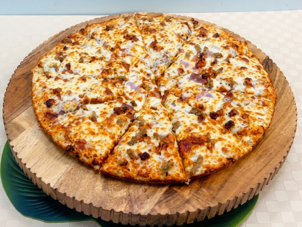 Meat lovers pizza loaded with toppings at New Pizza Factory near Laurel, Edmonton