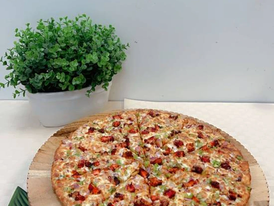 Loaded specialty pizza ready for delivery from New Pizza Factory in southeast Edmonton